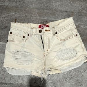 Levi’s vintage 527 boot cut ivory colored distressed jean shorts size 28x28